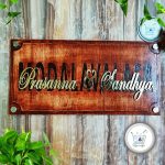 wooden name plate with brass letters